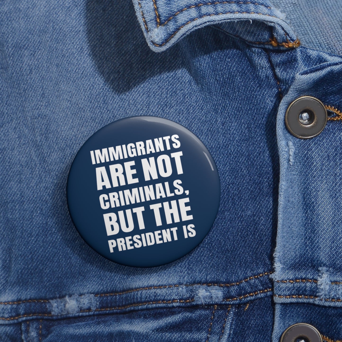 Button: "Immigrants Are Not Criminals, But the President Is"