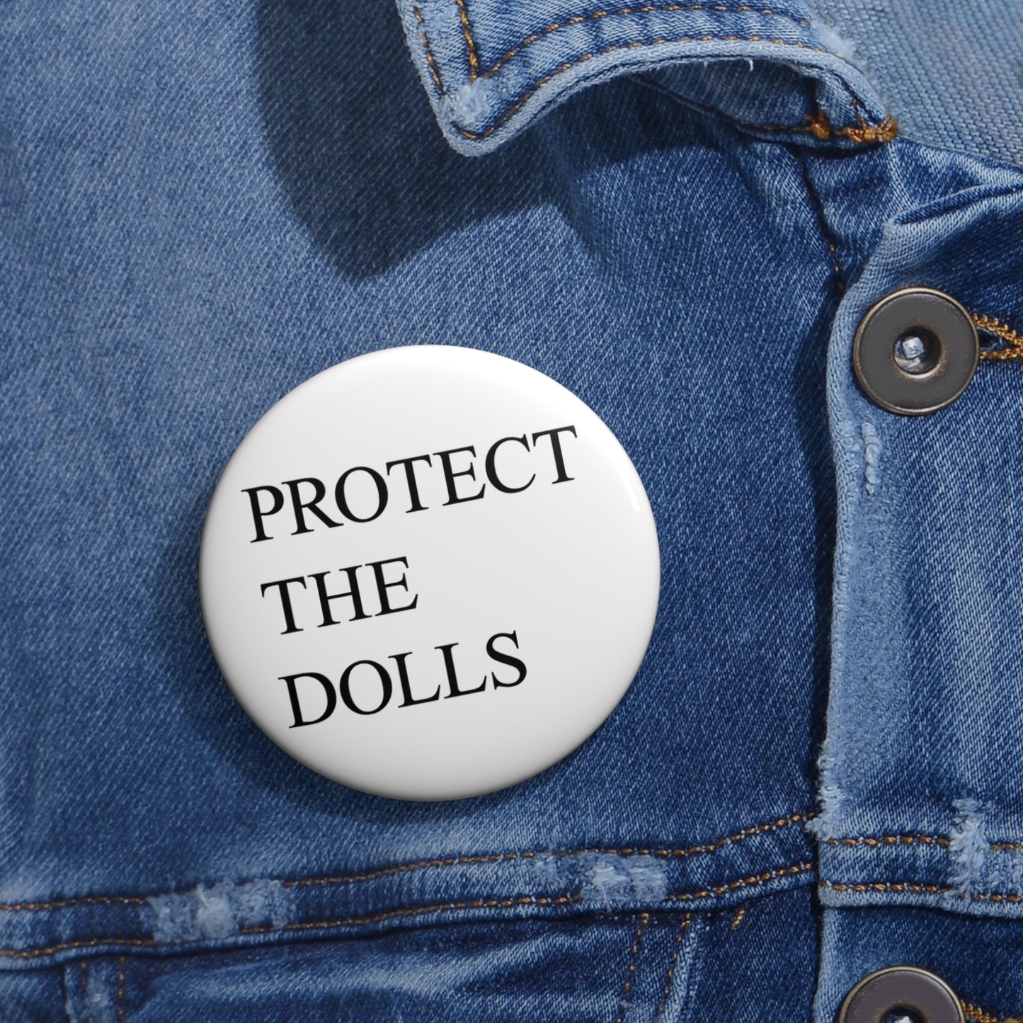 Button: "Protect the Dolls"